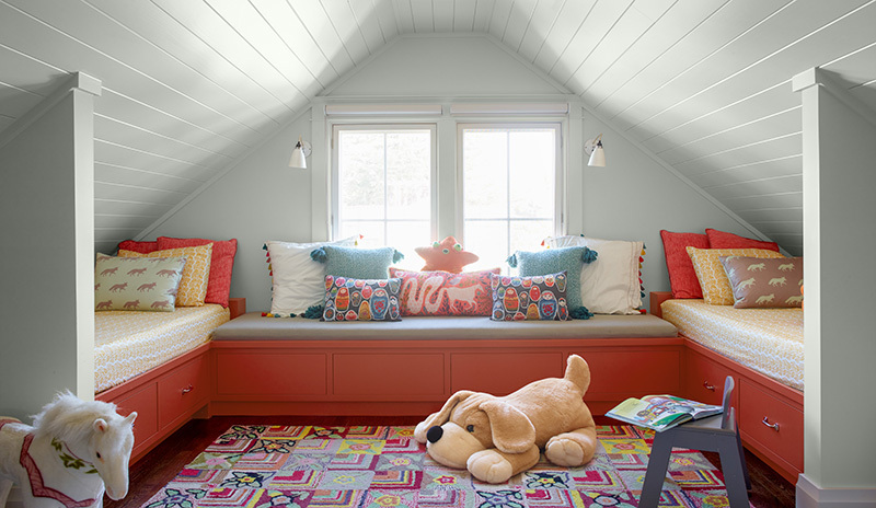 Kids' room: white shiplap, 2 beds & sofa on red drawers with blue chair, toys & accent pillows. Kids' room: white shiplap, 2 beds & sofa on red drawers with blue chair, toys & accent pillows.