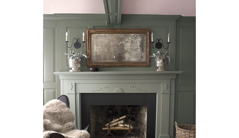 Olive green-painted walls with a light pink-painted ceiling and a muted green fireplace mantle. Olive green-painted walls with a light pink-painted ceiling and a muted green fireplace mantle.
