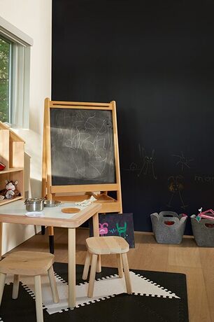 Play area w/ black chalkboard wall, easel, wooden drawing table, felt buckets for toys & shelves. Play area w/ black chalkboard wall, easel, wooden drawing table, felt buckets for toys & shelves.