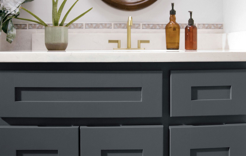 A close-up of a dark bathroom vanity cabinet with color Van Deusen Blue HC-156 A close-up of a dark bathroom vanity cabinet with color Van Deusen Blue HC-156